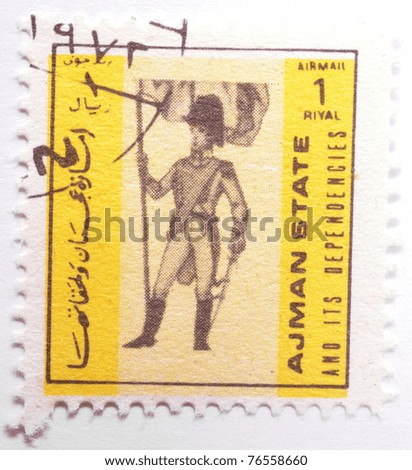 AJMAN - CIRCA 1970: a stamp from Ajman (now part of the United Arab Emirates) shows image of a soldier, circa 1970