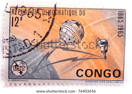 DEMOCRATIC REPUBLIC OF CONGO - CIRCA 1965: a stamp from the Democratic Republic of Congo shows image of the Earth and satellites, circa  1965