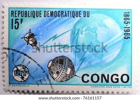 DEMOCRATIC REPUBLIC OF CONGO - CIRCA 1965: a 15 franc green, ultra and black stamp from the Democratic Republic of Congo shows image of the Earth and satellites, circa 1965