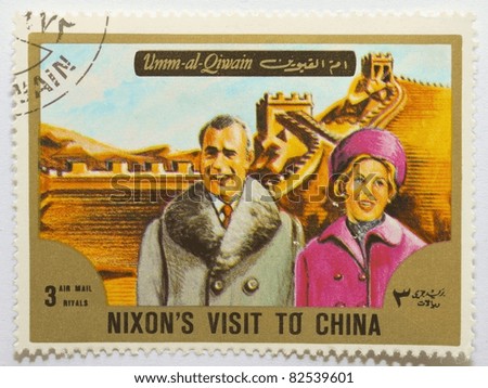 UMM AL-QIWAIN - CIRCA 1972: a stamp from Umm al-Qiwain shows image of US President Nixon\'s visit to China and the Great Wall, circa 1972