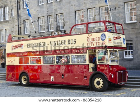 EDINBURGH - JULY 30: a vintage double decker tour bus on the Royal Mile on July 30, 2011 in Edinburgh, Scotland. Edinburgh is the UK\'s most visited tourist destination after London.