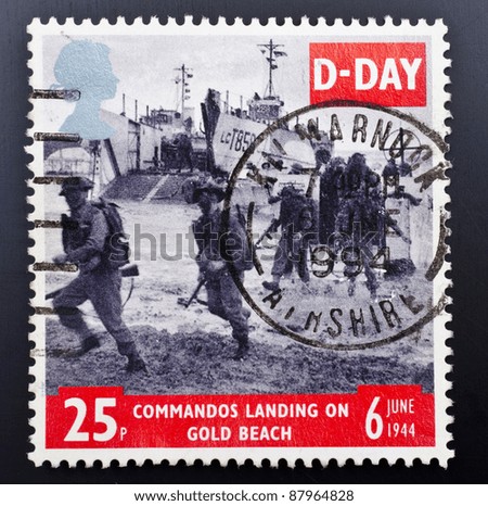 UNITED KINGDOM - CIRCA 1994: a stamp from the UK shows image of soldiers on Gold Beach in Normandy, commemorating D-Day, circa 1994