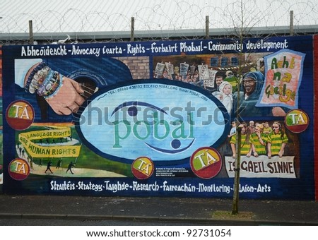 BELFAST, NORTHERN IRELAND - DECEMBER 31: a mural celebrates community development and the organisation pobal on December 31, 2011 on the Falls Road in Belfast, Northern Ireland.