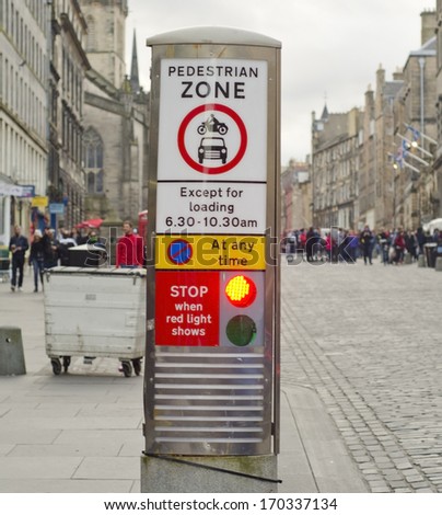 EDINBURGH, UK SEPTEMBER 22, 2013: a photo of a pedestrian zone sign. Pedestrian zones are areas of a city reserved for pedestrian only use and in which some or all automobile traffic is prohibited.