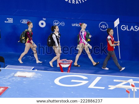 GLASGOW, UNITED KINGDOM - JULY 30: gymnasts are led towards the Uneven Bars in the Ladies All Around B Final at Commonwealth Games in SSE Hydro on July 30, 2014 in Glasgow, United Kingdom.