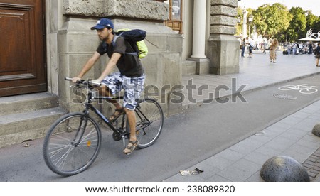LVIV, UKRAINE - SEPTEMBER 16: a man cycles in a bicycle lane on September 16, 2014 in Lviv, Ukraine. The German Development Agency (GIZ) supported the development of 15 km of bicycle lanes in Lviv.