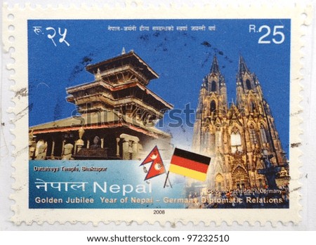 NEPAL - CIRCA 2008: a stamp printed in Nepal shows image of Dattatreya Temple in Bhaktapur and Cologne Cathedral in Germany, circa 2008
