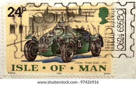 ISLE OF MAN - CIRCA 1995: A stamp from the Isle of Man shows image of Stirling Moss driving a racing car, circa 1995