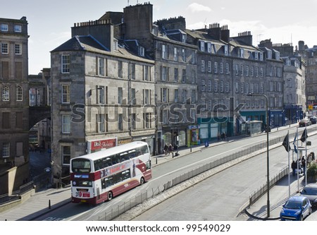 EDINBURGH - MARCH 31: A bus passes tenements at the south end of Leith Street in the New Town on March 31, 2012 in Edinburgh, Scotland. Edinburgh\'s New Town is a UNESCO World Heritage Site.