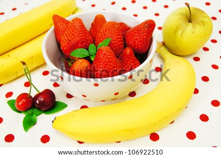 Beautiful strawberries ,apple,bananas and cherry