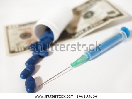 high costs of expensive medication concept - money,pills and injection