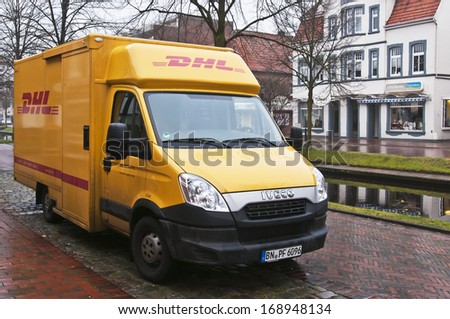 Papenburg, Germany - December 14: Dhl Vans Parked In Papenburg, Germany On December 14, 2013. Dhl Is A World Wide Courier Company That Operates In 220 Countries With Over 285,000 Employees.