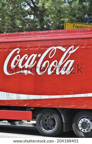 KRONBERG, GERMANY - JUNY 22: Red Coca-Cola truck at the city street on Juny 22,2014 in Kronberg, Germany.
