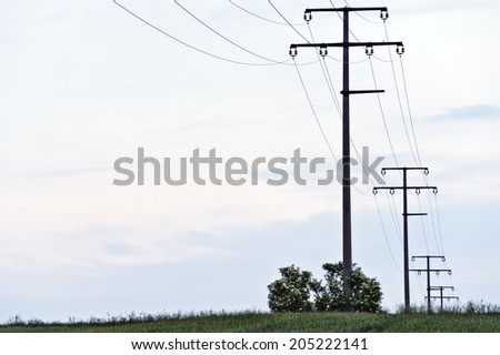 electricity pylons in the green field
