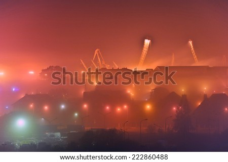 KLAIPEDA,LITHUANIA- OCT 10:view of the city at night in the fog  on October 10,2014 in Klaipeda, Lithuania.
