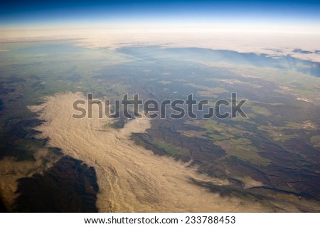 view of the earth in cloudy day and fog