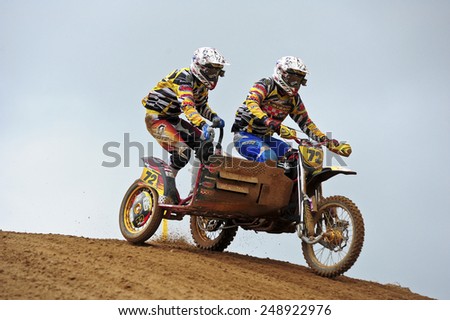 PLUNGE,LITHUANIA-MAY 11:Unidentified riders in action in Lithuanian Open Motocross Championship 2012 first roundon May 11,2012 in Plunge, Lithuania.