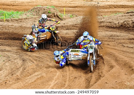 PLUNGE,LITHUANIA-MAY 11:Unidentified riders in action in Lithuanian Open Motocross Championship 2012 first roundon May 11,2012 in Plunge, Lithuania.