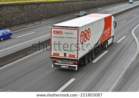 MAINZ, GERMANY - FEB 09: TNT delivery truck on the highway on February 09,2015 in Mainz, Germany.TNT is an international courier delivery services company with headquarters in Hoofddorp, Netherlands.