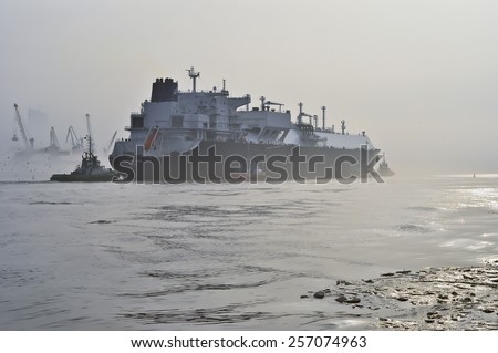 KLAIPEDA,LITHUANIA- FEB 28:GOLAR SEAL LNG Tanker in Klaipeda port  in very cloudy and foggy day on February 28,2015 in Klaipeda, Lithuania. GOLAR SEAL is LNG Tanker, registered in Marshall Islands.