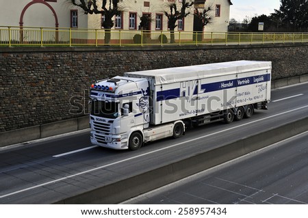 MAINZ,GERMANY-FEB 20:SCANIA blue truck on the highway on February 20,2015 in Mainz,Germany.Scania, is a major Swedish automotive industry manufacturer of specifically heavy trucks and buses.