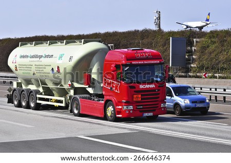 FRANKFURT,GERMANY-MARCH 28:SCANIA oil truck on the highway on March 28,2015 in Frankfurt,Germany.Scania, is a major Swedish automotive industry manufacturer of specifically heavy trucks and buses.