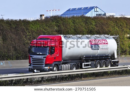 FRANKFURT,GERMANY-MARCH 28:SCANIA oil truck on the highway on March 28,2015 in Frankfurt,Germany.Scania, is a major Swedish automotive industry manufacturer of specifically heavy trucks and buses.