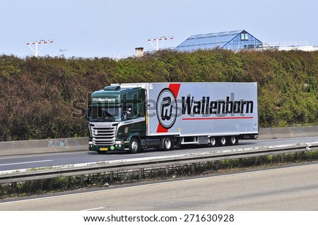 FRANKFURT,GERMANY-MARCH 28:SCANIA truck on the highway on March 28,2015 in Frankfurt,Germany.Scania, is a major Swedish automotive industry manufacturer of specifically heavy trucks and buses.