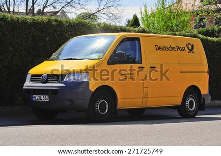 FRANKFURT,GERMANY-APRIL 22:yellow van of Deutsche Post on the street on April 22,2015 in Frankfurt,Germany.Deutsche Post AG is the world's largest courier company.