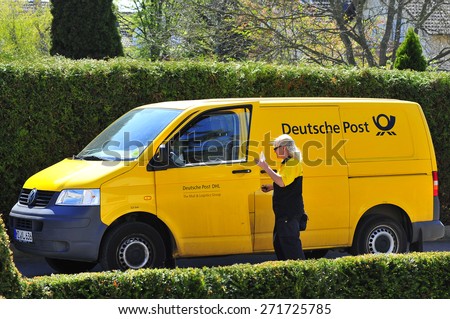 FRANKFURT,GERMANY-APRIL 22:yellow van of Deutsche Post on the street on April 22,2015 in Frankfurt,Germany.Deutsche Post AG is the world\'s largest courier company.