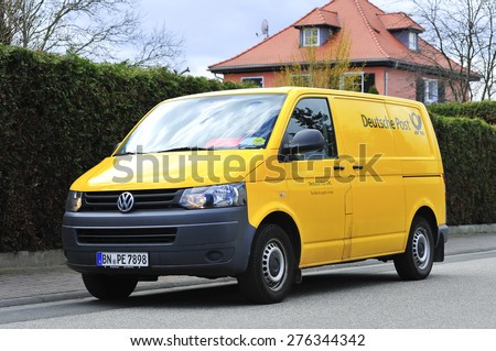 FRANKFURT,GERMANY-APRIL 01: yellow van of Deutsche Post on the street on April 01,2015 in Frankfurt,Germany. Deutsche Post AG is the world\'s largest courier company.