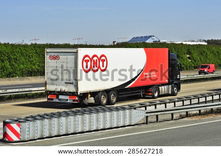 FRANKFURT,GERMANY- APRIL10:TNT delivery truck on the highway on April 10,2015 in Frankfurt,Germany.TNT is an international courier delivery services company with headquarters in Hoofddorp, Netherlands