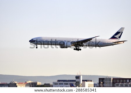 FRANKFURT,GERMANY-MAY 13:airplane of Cathay Pacific above the Frankfurt airport on May 13,2015 in Frankfurt,Germany