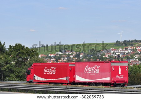 FRANKFURT,GERMANY-JULY 31:red Coca- Cola truck on July 31,2015 in Frankfurt,Germany.Coca-Cola is a carbonated soft drink sold in stores, restaurants, and vending machines throughout the world