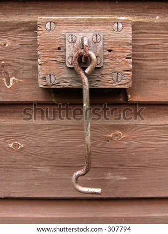 hook on the side of a shed to hold back the door