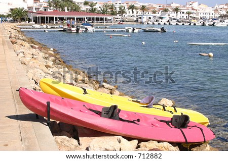 sea canoes on the side of the bay