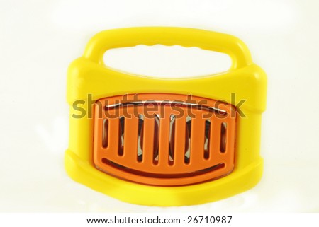 plastic toy instrument with cymbals inside of it