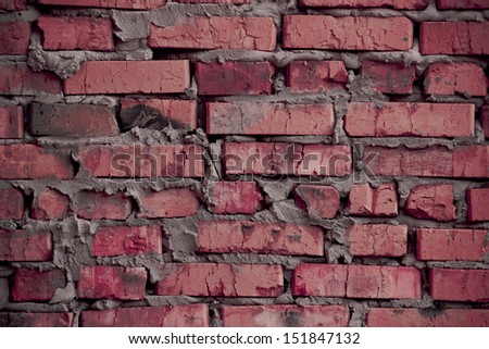 Background based on the brickwork of the cracked and weathered stained rough brick. Art edition. Rustic pink (rosy) stylized brick.