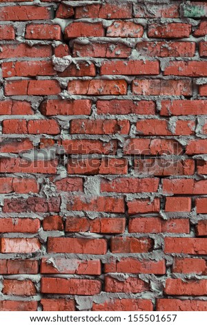 Multicolored brickwork background that based on the brick wall of rough colored bricks.
