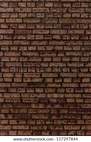 Multi colored brickwork background based of the wall of rough brickwork (masonry).