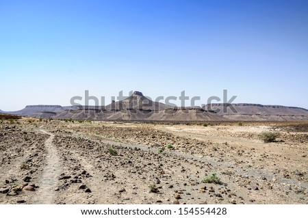 Hamada du Draa,  Morocco stone desert with path