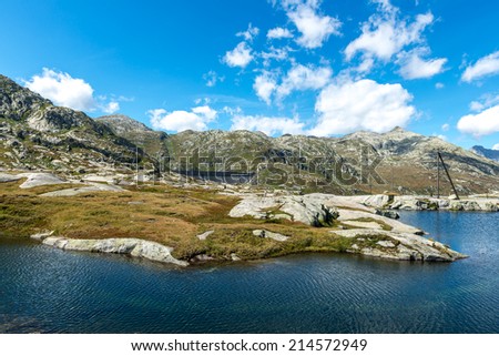 Dam of Lucendro and lake Saint Charles in foreground, Gotthard Pass, Canton of Ticino (Switzerland)