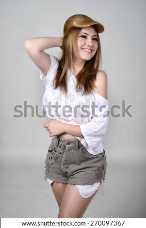 girl in shorts and a t-shirt with hairstyle like a baseball cap