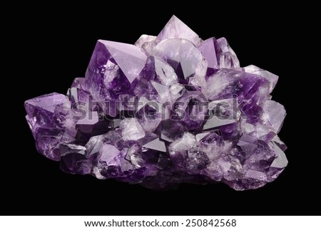 Amethyst over black background, a violet variety of quartz, often used in jewelry. Silica, silicon dioxide, SiO2.