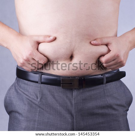 Half-naked man holding big belly