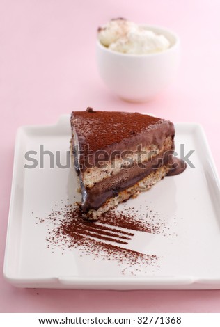 a slice of chocolate mousse cake with whipped cream