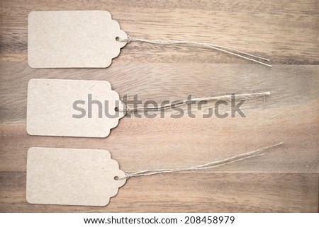Paper tag labels on wooden background