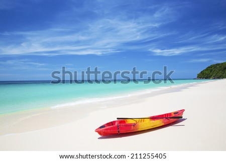 Red and yellow kayaks on the tropical beach, Koh Mai Ton island, Thailand