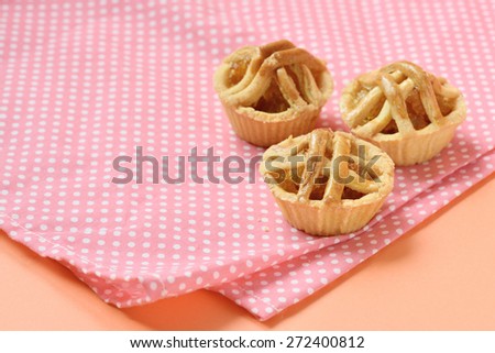 Pineapple pies on pink and white polka dot background