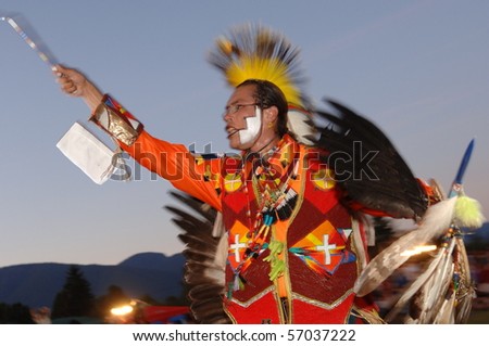 WEST VANCOUVER, BC, CANADA - JULY 10: Native Indian man dances during annual Squamish Nation Pow Wow on July 10, 2010 in West Vancouver, BC, Canada